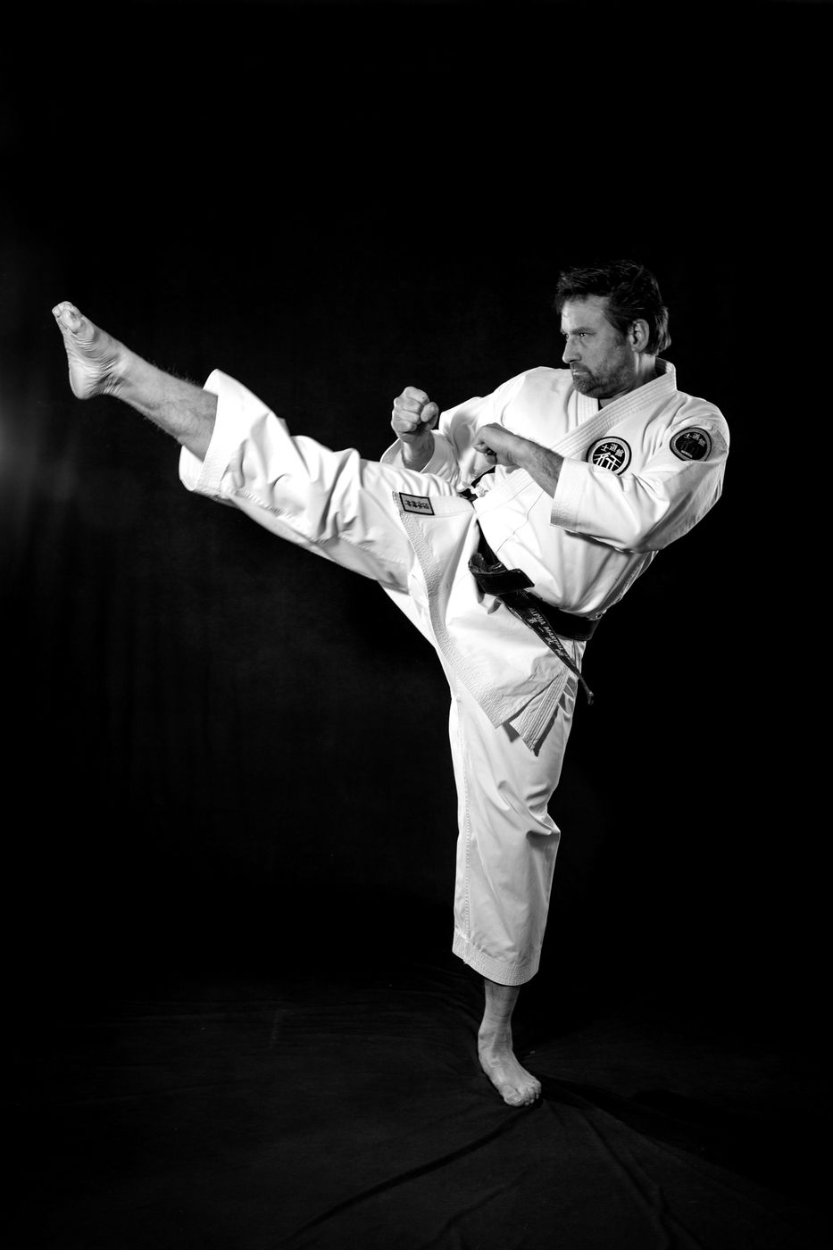 Alpha Martial Arts Academy student breaking a board